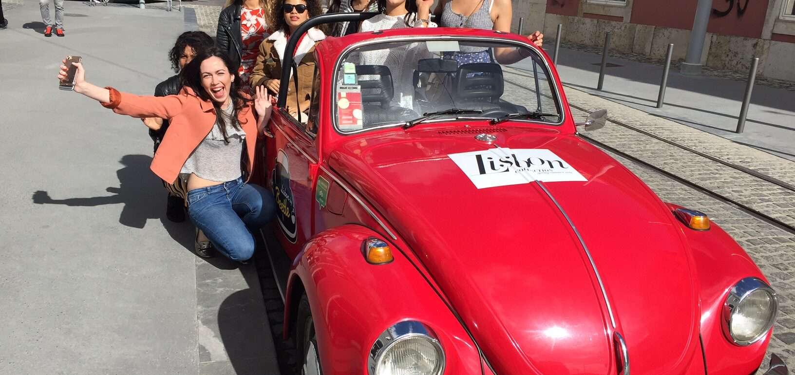 Lisbon Vintage Beetle with happy group of people