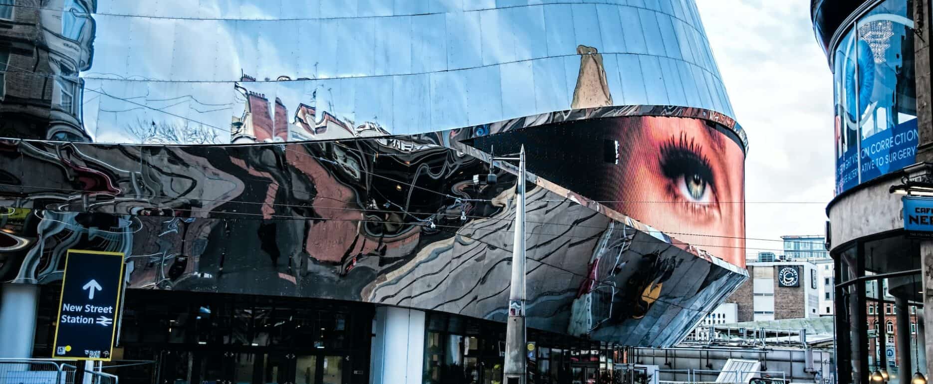 Birmingham UK, pedestrian and person with impressive building behind